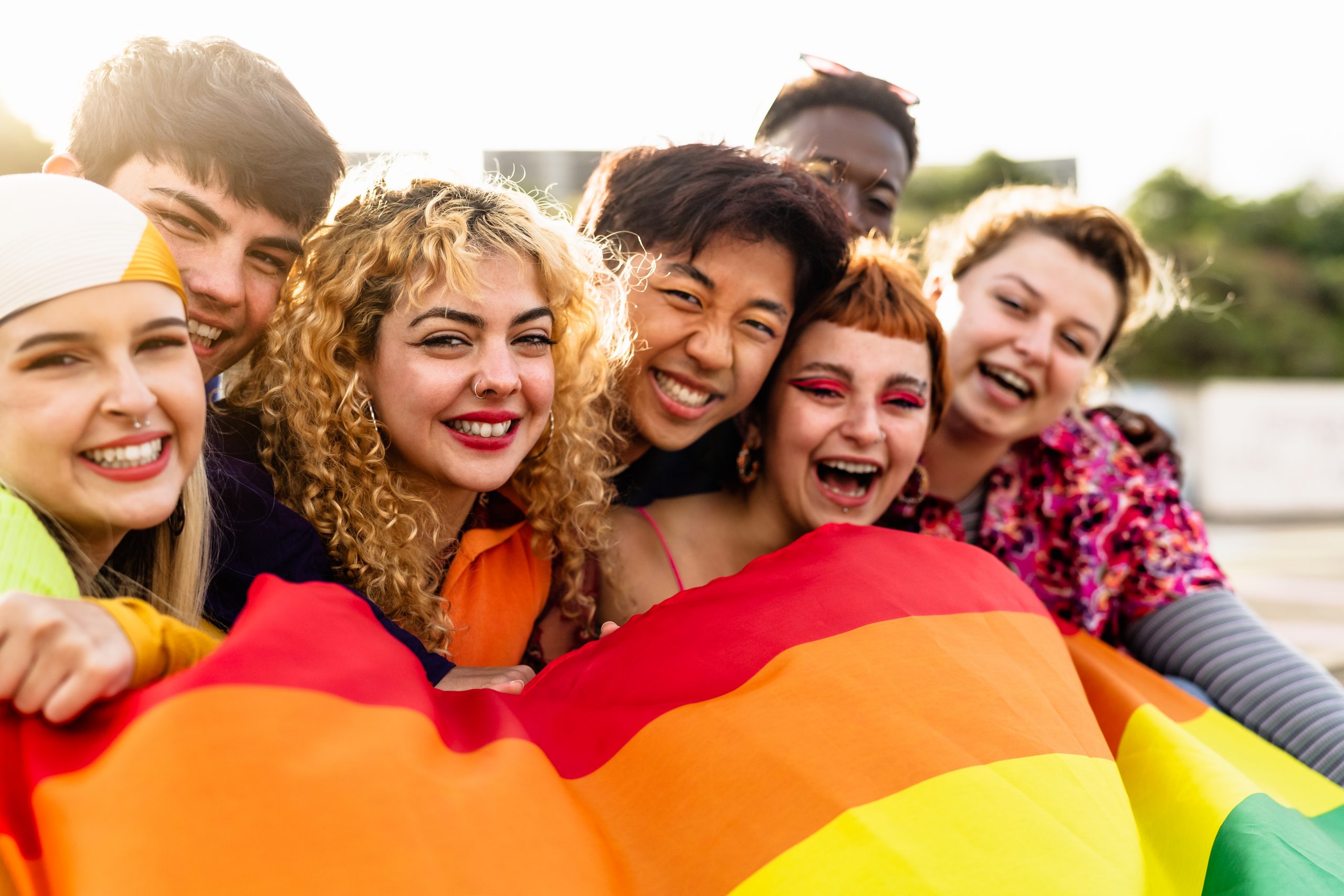 Diverse young friends celebrating gay pride festival – LGBTQ com